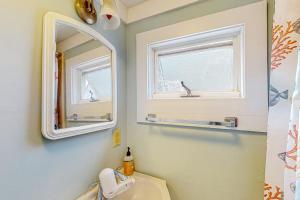 a bathroom with a sink and a mirror at Bayview Escape in Provincetown +7 photos