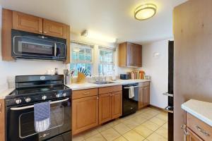 a kitchen with a stove and a sink at The Lodge in Provincetown +19 photos