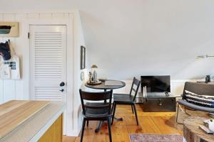 a kitchen and dining room with a table and chairs at The Buoy Room in Provincetown
