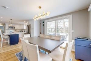 a kitchen and dining room with a table and chairs at Champagne Dreams in Dennis +24 photos