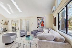 a living room with a couch and a table at Twin Ponds in Oak Bluffs