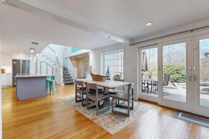 a kitchen and dining room with a table and chairs at Cape Bliss in Yarmouth