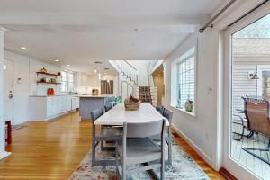 a kitchen and dining room with a table and chairs at Cape Bliss in Yarmouth