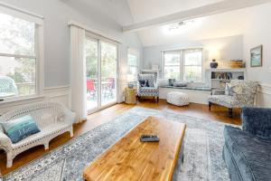 a living room with a couch and a coffee table at Ferry Harbor Cottage in Falmouth