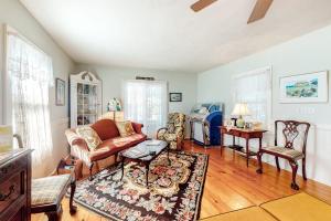 a living room with a couch and a table at Island Dream in Oak Bluffs