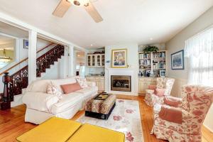 a living room with a couch and a fireplace at Island Dream in Oak Bluffs