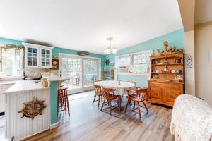 a kitchen and dining room with a table and chairs at Summer Daze in Edgartown