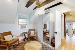 a living room with chairs and a table at Sankofa House in Oak Bluffs