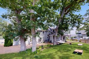 a house with two trees in the yard at Sankofa House in Oak Bluffs