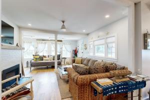 a living room with a couch and a fireplace at Sankofa House in Oak Bluffs