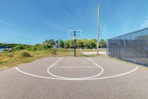 a basketball court with a basketball hoop at Falmouth Beach House in Falmouth