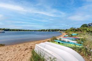 a group of boats sitting on the beach at Falmouth Beach House in Falmouth