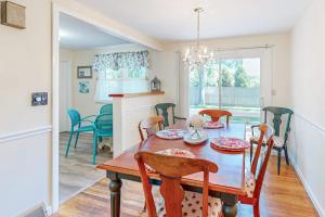 a kitchen and dining room with a table and chairs at Falmouth Beach House in Falmouth +24 photos