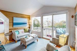 a living room with a view of the ocean at Bayview Bliss in Provincetown