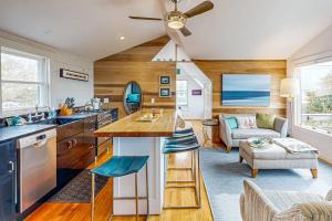 a kitchen and living room with a ceiling fan at Bayview Bliss in Provincetown +15 photos