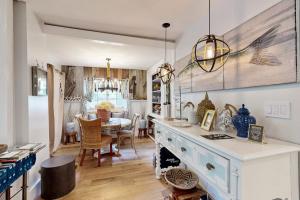 a kitchen with a counter and a dining room at Sankofa Martha's Vineyard in Oak Bluffs