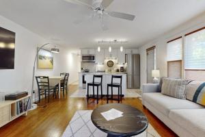 a living room with a couch and a table at Endless Summer in Provincetown