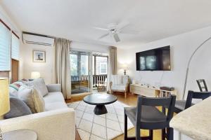 a living room with a couch and a table at Endless Summer in Provincetown +19 photos