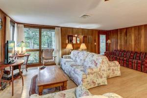 a living room with a couch and a table at Eastham Escape in North Eastham