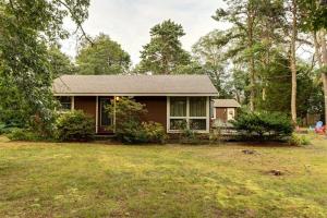 a house with a yard in front of it at Eastham Escape in North Eastham