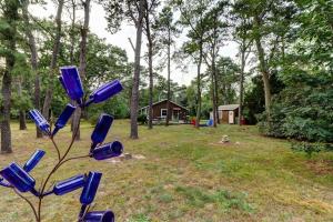 a blue bottle tree in the middle of a yard at Eastham Escape in North Eastham