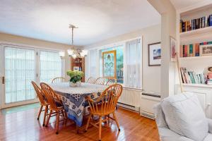 a dining room with a table and chairs at Island Oasis in Edgartown