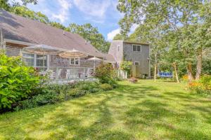 a house with a yard with a playground at Island Oasis in Edgartown