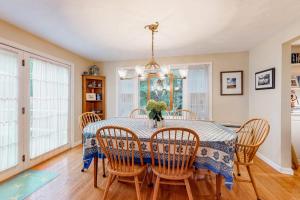 a dining room with a table and chairs at Island Oasis in Edgartown +23 photos