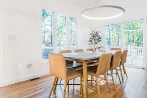 a dining room with a table and chairs at Peace Among the Pines in Wellfleet