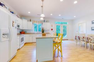 a kitchen with white cabinets and a table and chairs at Seaward Seahawk 9429 in Berlin