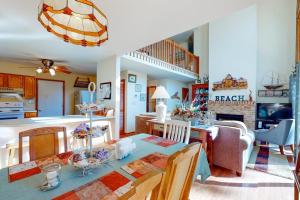 a kitchen and living room with a table and chairs at Dove Lane 8 in Ocean Pines