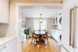 a kitchen and dining room with a table and chairs at Island Home in Vineyard Haven