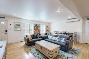 a living room with a couch and a table at Bird Street Breeze in Oak Bluffs