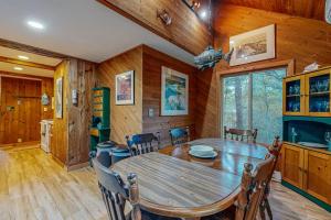 a dining room with a wooden table and chairs at Cozy Island Cabin in Edgartown