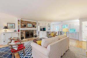 a living room with a couch and a fireplace at Mermaid's Rest in Centerville