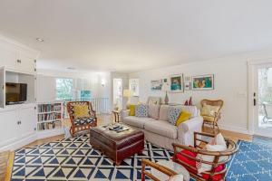 a living room with a couch and chairs at Mermaid's Rest in Centerville