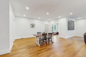 a dining room with a table and chairs at Heritage Escape in Mashpee