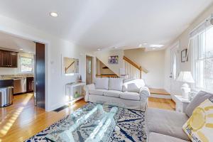a living room with a couch and a rug at Pond View Getaway in Sandwich