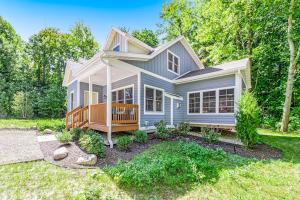 a house with a porch and a yard at Friendly Farms in Lakeside