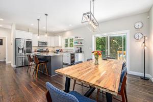 a kitchen with a wooden table and chairs at Friendly Farms in Lakeside