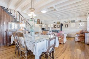 a dining room with a table and chairs at Anna's Cottage in Saugatuck