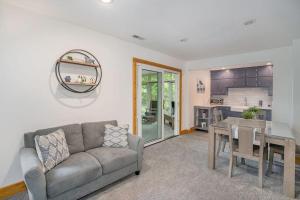a living room with a couch and a table at Tower Hill Cottage in Sawyer
