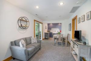 a living room with a couch and a table at Tower Hill Cottage in Sawyer