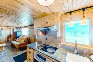 a kitchen with a sink and a stove in a room at Dune Grass Shores in Beulah