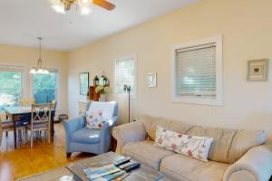 a living room with a couch and a table at Green Glen in Empire