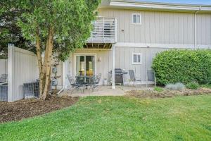 a house with a patio with chairs and a tree at Bluebird Condo in Douglas