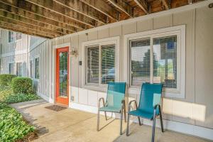 two blue chairs sitting on the porch of a house at Bluebird Condo in Douglas