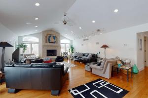 a living room with two couches and a fireplace at Downtown Hideaway in New Buffalo