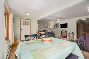 a living room with a table with a bowl on it at Carol's Cottage in Empire