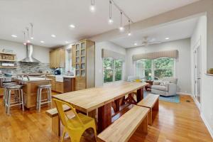 a kitchen with a large wooden table in a room at Grand Getaway in Grand Beach